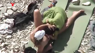 Beach Voyeur&period; Unashamed nudists having sex out of reach of the beach right near others